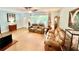 Cozy living room with tile flooring, comfortable leather seating, and plenty of natural light at 481 Reading Nw St, Port Charlotte, FL 33952