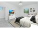 Comfortable bedroom with a large bed, stylish decor, and plenty of natural light at 4862 Kiska Rd, North Port, FL 34288