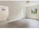 Minimalist bedroom with a chandelier, a large window, and bright walls at 4862 Kiska Rd, North Port, FL 34288