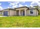Charming home featuring a well-maintained lawn and a welcoming entrance at 4862 Kiska Rd, North Port, FL 34288