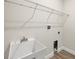 Functional laundry room featuring a utility sink, wire shelving, and updated connections at 4862 Kiska Rd, North Port, FL 34288