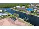 Aerial view features waterfront home, boat dock, with scenic water views at 5023 Key Largo Dr, Punta Gorda, FL 33950