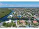 Beautiful waterfront home with private boat dock and surrounded by lush landscaping at 5023 Key Largo Dr, Punta Gorda, FL 33950