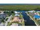 Aerial view showcasing a waterfront home with private dock and gorgeous water views at 5023 Key Largo Dr, Punta Gorda, FL 33950