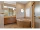 Elegant bathroom with a large soaking tub, separate shower, and a double vanity with ample counter space at 5023 Key Largo Dr, Punta Gorda, FL 33950