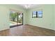This bedroom features a pool view, a ceiling fan, and wood-look floors at 5023 Key Largo Dr, Punta Gorda, FL 33950