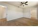 This bedroom features wood-look floors and a view of the walk in closet at 5023 Key Largo Dr, Punta Gorda, FL 33950
