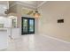 Dining area has elegant Tiffany style lighting and access to backyard at 5023 Key Largo Dr, Punta Gorda, FL 33950
