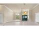 Elegant foyer with tiled flooring, chandelier lighting, and a grand entryway at 5023 Key Largo Dr, Punta Gorda, FL 33950