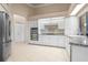 Well-lit kitchen features stainless steel appliances, and white cabinets at 5023 Key Largo Dr, Punta Gorda, FL 33950