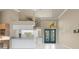 Kitchen featuring white cabinetry, tile flooring, and breakfast bar at 5023 Key Largo Dr, Punta Gorda, FL 33950