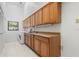 A bright laundry room with sink, storage, and appliances at 5023 Key Largo Dr, Punta Gorda, FL 33950