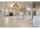 Open concept living room boasts fireplace, many windows, and great lighting at 5023 Key Largo Dr, Punta Gorda, FL 33950