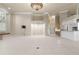 Spacious living room featuring a fireplace, and easy access to kitchen area at 5023 Key Largo Dr, Punta Gorda, FL 33950