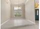 Bright and airy living room featuring tile flooring and high ceilings at 5023 Key Largo Dr, Punta Gorda, FL 33950
