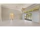 Bright living room featuring tile floors, high ceilings, and access to the pool area at 5023 Key Largo Dr, Punta Gorda, FL 33950