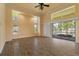 Inviting living room with wood floors, bright lighting, and large windows offering picturesque outdoor views at 5023 Key Largo Dr, Punta Gorda, FL 33950