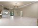 Expansive living room featuring tile floors, high ceilings, and an open floor plan, bathed in natural light at 5023 Key Largo Dr, Punta Gorda, FL 33950
