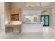 Office nook in kitchen area with built-in shelving and granite countertops at 5023 Key Largo Dr, Punta Gorda, FL 33950