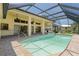 Inviting pool with screened enclosure, tile coping and covered patio at 5023 Key Largo Dr, Punta Gorda, FL 33950