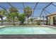 Lovely screened pool surrounded by lush tropical landscaping and canal views at 5023 Key Largo Dr, Punta Gorda, FL 33950