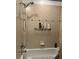 Shower/tub combo with tile surround and showerhead at 5114 Melbourne St # A302, Punta Gorda, FL 33980
