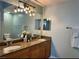 Bathroom with double sinks, granite countertop, and vanity lighting at 5114 Melbourne St # A302, Punta Gorda, FL 33980