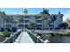 Beautiful condominium complex with waterfront access and a wooden walkway to the building at 5114 Melbourne St # A302, Punta Gorda, FL 33980