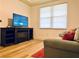 Cozy living room with electric fireplace and flat screen television at 5114 Melbourne St # A302, Punta Gorda, FL 33980
