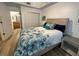 Comfortable bedroom with hardwood floors and an ensuite bath at 5114 Melbourne St # A302, Punta Gorda, FL 33980