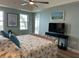 Comfortable main bedroom featuring water views from the windows and access to the bathroom at 5114 Melbourne St # A302, Punta Gorda, FL 33980