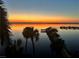 Scenic sunset overlooking the tranquil waterfront with a fishing pier for residents and guests at 5114 Melbourne St # A302, Punta Gorda, FL 33980