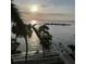Scenic waterfront view showcasing a dock extending into the water, creating a tranquil and inviting atmosphere at 5114 Melbourne St # A302, Punta Gorda, FL 33980