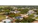 Aerial view of home with screened pool and large yard highlighting the outdoor space and backyard privacy at 5532 Veracruz Ter, Port Charlotte, FL 33981