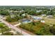 Bright aerial view of a home with an enclosed pool and spacious outdoor living spaces on a large lot at 5532 Veracruz Ter, Port Charlotte, FL 33981