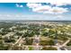 A home situated on a large lot, surrounded by trees and other houses, offering ample space and privacy at 5532 Veracruz Ter, Port Charlotte, FL 33981