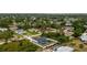 A bird's-eye view of a cozy home with a screened-in pool and fenced yard, highlighting its appealing features at 5532 Veracruz Ter, Port Charlotte, FL 33981