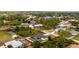 Overhead view of a home with a screened-in pool, showing its layout and the well-maintained grounds at 5532 Veracruz Ter, Port Charlotte, FL 33981