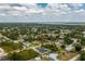 An aerial view of the neighborhood, showcasing community layout and home's placement with a screened in pool at 5532 Veracruz Ter, Port Charlotte, FL 33981
