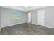 Bedroom featuring hardwood floors, natural light, and neutral paint at 5532 Veracruz Ter, Port Charlotte, FL 33981