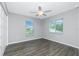 Bright bedroom featuring hardwood floors and natural light at 5532 Veracruz Ter, Port Charlotte, FL 33981