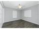 Bedroom featuring hardwood floors and two windows at 5532 Veracruz Ter, Port Charlotte, FL 33981