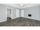 Open bedroom with hardwood floors and access to a bathroom and closet at 5532 Veracruz Ter, Port Charlotte, FL 33981