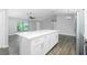 Spacious kitchen island with white cabinets and ample counter space, perfect for meal preparation and entertaining at 5532 Veracruz Ter, Port Charlotte, FL 33981