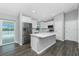 Modern kitchen features stainless steel appliances, a large kitchen island and stylish backsplash at 5532 Veracruz Ter, Port Charlotte, FL 33981