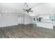 Spacious open-concept living area seamlessly connects to the kitchen, featuring modern flooring and stylish lighting at 5532 Veracruz Ter, Port Charlotte, FL 33981