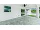 Screened-in patio featuring tile flooring and views of the backyard at 5532 Veracruz Ter, Port Charlotte, FL 33981
