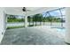Spacious screened-in patio with a pool and lush green surroundings at 5532 Veracruz Ter, Port Charlotte, FL 33981
