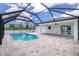 Screened-in pool with brick patio, access to outdoor and indoor space, plus lovely surrounding views at 5532 Veracruz Ter, Port Charlotte, FL 33981
