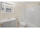 Bathroom with shower and tub and vanity with sink at 6850 S Biscayne Dr, North Port, FL 34287